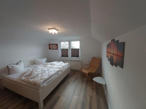 Postel nebo postele na pokoji v ubytování Ferienwohnung Hus Achtern Diek