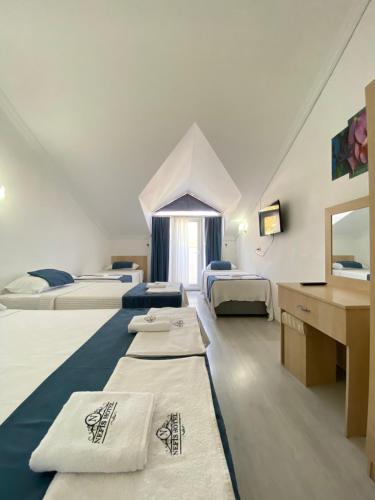 Postel nebo postele na pokoji v ubytování Nefis Hotel Ölüdeniz