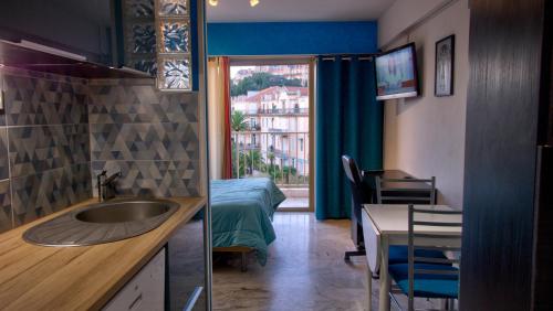 a bathroom with a sink and a room with a bed at 3 StarsStudio54 23 Ave Laugier100m Plages Mistral in Cannes