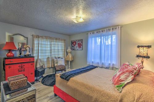 a bedroom with a bed and a dresser and a window at Charming Apartment Less Than 1 Mi to Logan River and Zootah! in Logan