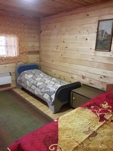 Кровать или кровати в номере Гостевой дом Хуторок