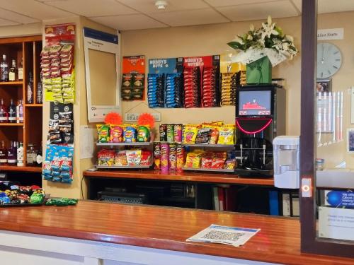 a counter in a store with chips and snacks at The Beechfield Hotel in Blackpool