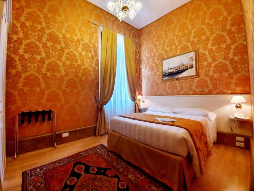 Postel nebo postele na pokoji v ubytování Hotel Corte dei Greci