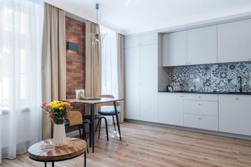 Kuchyň nebo kuchyňský kout v ubytování Apartamenty ZŁOTY PIERNIK
