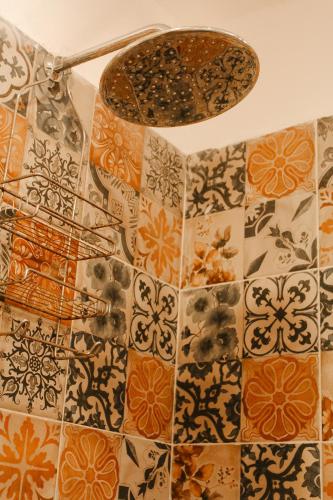 a room with a bunch of tiles on a wall at Kay Apartments Isla Mujeres in Isla Mujeres