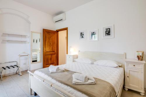 Postel nebo postele na pokoji v ubytování The Country in the City - Parco delle Cascine Apartments
