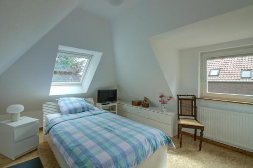 Postel nebo postele na pokoji v ubytování Haus Tapken mit Meerblick