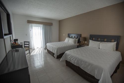 Cama o camas de una habitación en Ocean View Cancun Arenas