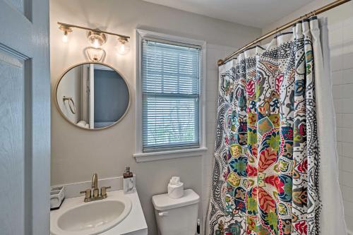 a bathroom with a sink and a shower curtain at Charming Boho Breeze Retreat with Pool Access in Key West