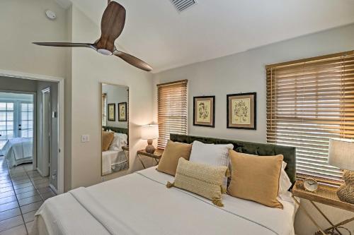 a bedroom with a bed and a ceiling fan at Charming Boho Breeze Retreat with Pool Access in Key West