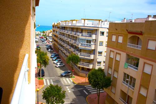 an aerial view of a street in a city with buildings at Los Naranjos in Guardamar del Segura