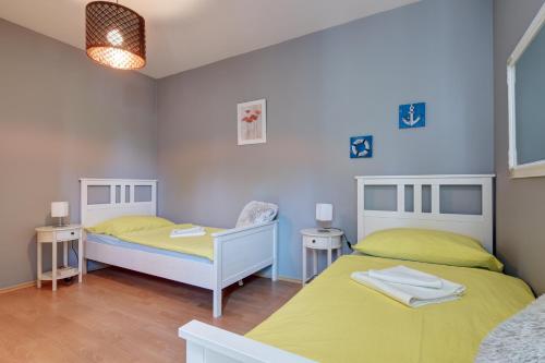 Posteľ alebo postele v izbe v ubytovaní Bella Golden Beach Siófok