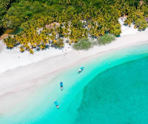 an aerial view of a beach with boats in the water at Hotel Santa Catalina Panamá in Santa Catalina