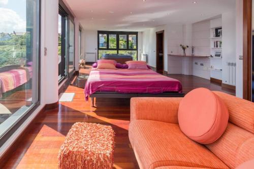 Ένα ή περισσότερα κρεβάτια σε δωμάτιο στο Espectacular villa al borde del mar