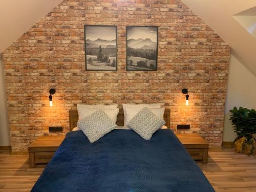 Postel nebo postele na pokoji v ubytování Apartament Stożek