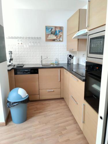a kitchen with a sink and a stove top oven at Luxury Loft Lourdes in Lourdes