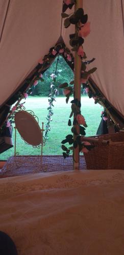 a view from inside a tent with a window at The Homestead in West Parley