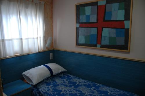 Postel nebo postele na pokoji v ubytování Hostal El Cartero