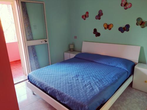 Katil atau katil-katil dalam bilik di Casa vacanze Wally a Posada, Sardegna