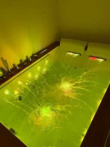 a bathroom with a green sink in a room at A-mare Exclusive Rooms & Suites in Taranto
