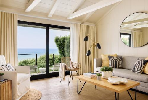 a living room with a view of the ocean at Gurney's Montauk Resort & Seawater Spa in Montauk