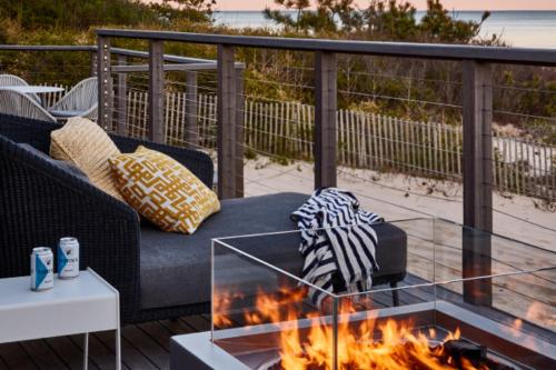 a living room with a couch and a fire place at Gurney's Montauk Resort & Seawater Spa in Montauk