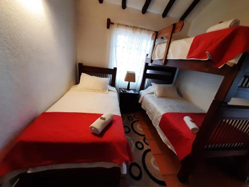 Ένα ή περισσότερα κρεβάτια σε δωμάτιο στο Aparta Hotel El Refugio de María