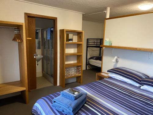 A bed or beds in a room at Ripparoo Lodge