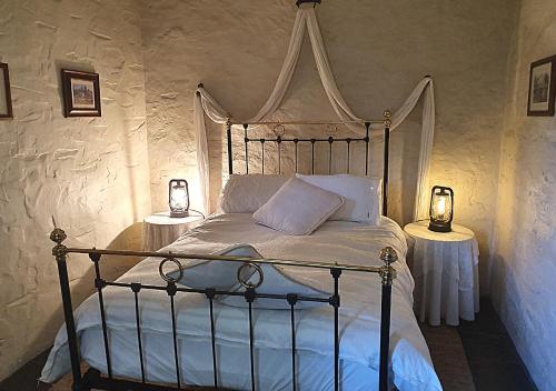Кровать или кровати в номере Griffiths Cottage