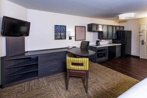 A television and/or entertainment centre at Candlewood Suites Appleton, an IHG Hotel