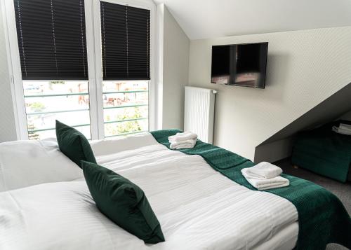 Katil atau katil-katil dalam bilik di Hotel KAVKA & Restauracja