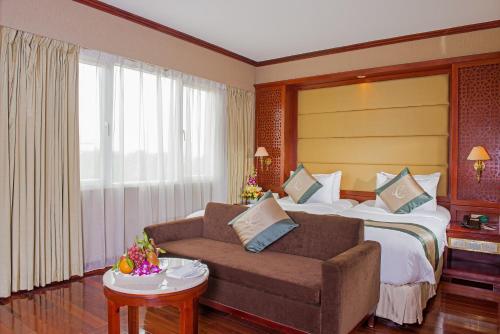 Кровать или кровати в номере Conifer Boutique Hotel