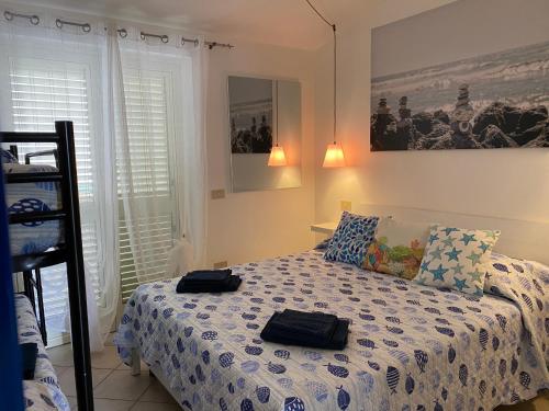 Posteľ alebo postele v izbe v ubytovaní Casa vacanze La Balena2