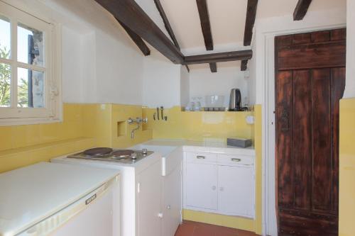Η κουζίνα ή μικρή κουζίνα στο Villa Pointe Alègre