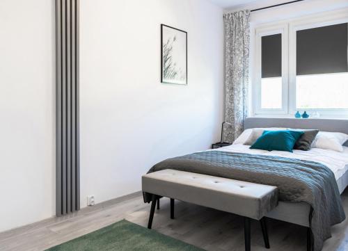 Posteľ alebo postele v izbe v ubytovaní Quadratum Apartment by Noclegi Renters