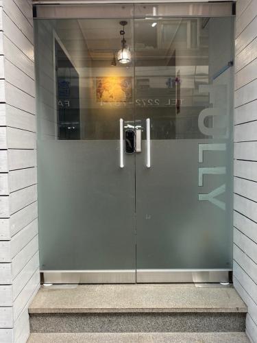 a glass door in a building with at Fully Mini Hotel in Seoul