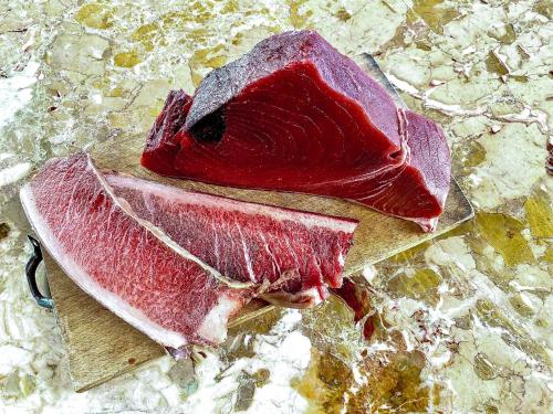 two pieces of meat sitting on a table at Arte Povera Landhaus in idyllischem Naturreservat in Custonaci