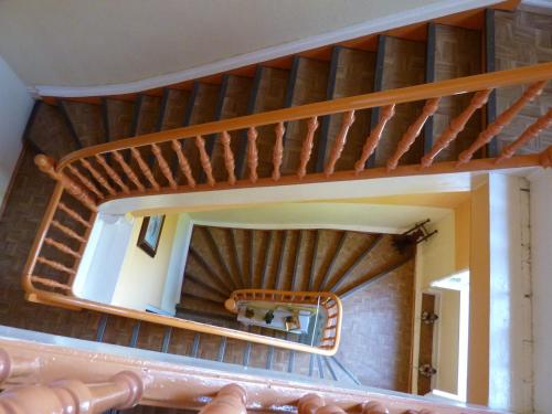 a mirror in a room with a spiral staircase at Hotel Waldfriede in Darmstadt