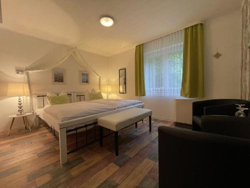 A bed or beds in a room at Astoria Hotel Bad Wildstein