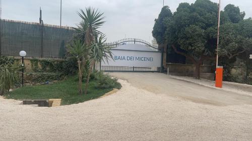 a building with a sign that reads san diego needed at Baia Dei Micenei in Otranto