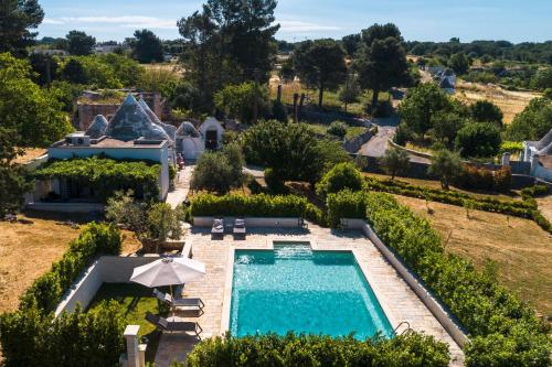 The swimming pool at or close to HelloApulia - Trulli Le Murge