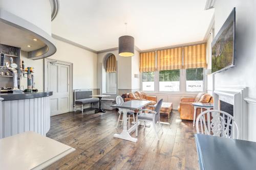 a living room with a couch and a table at Best Western Walton Park Hotel in Clevedon