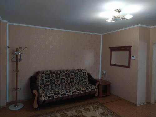 a living room with a couch and a ceiling at Комфортные апартаменты на приватной територии in Izmail