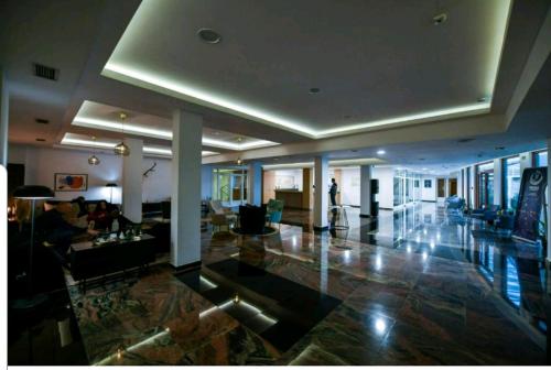 a large room with a lobby with people in it at MONA RELAX in Vrnjačka Banja