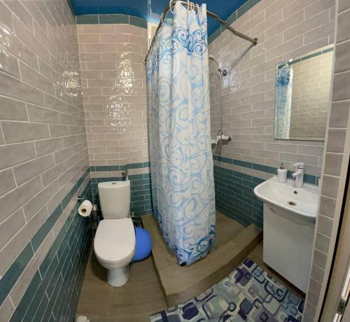 a bathroom with a toilet and a sink at ZAKAT in Zatoka