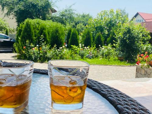 two glasses of water sitting on a table at Villa Nina in Campina