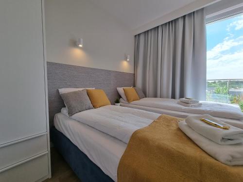 Postel nebo postele na pokoji v ubytování Apartament Południowy Gąski - 365PAM