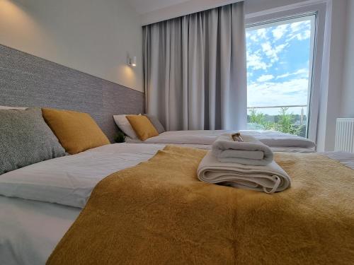 Posteľ alebo postele v izbe v ubytovaní Apartament Południowy Gąski - 365PAM