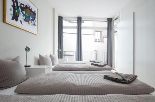 Letto o letti in una camera di HITrental Marktplatz Apartments