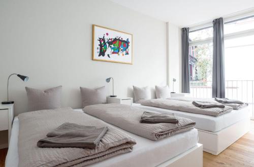 Letto o letti in una camera di HITrental Marktplatz Apartments